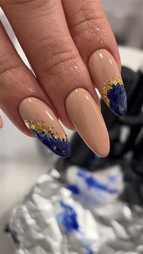 Nude Almond Nails With Blue Marble Design And Gold Foil Flakes Gold