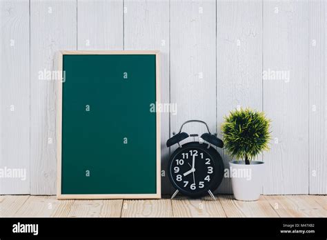 Blank Green Chalkborad With Wood Frame And Little Decorative Tree In White Vase And Vintage