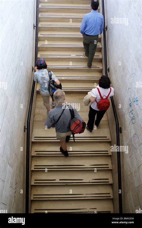 Group people climbing stairs street hi-res stock photography and images ...