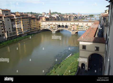 The Famous Landmark Of The Ponte Vecchio Crossing Over The Arno River