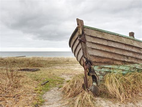 Abandoned Wrecked Boat Stuck In Sand Old Wooden Boat On The Sandy