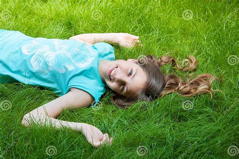 Pretty Teen Girl Lying On The Grass Laughter Joy Positive Emotions