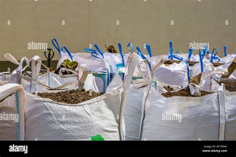 White Big Bags Full With Potting Soil Horticulture And Agriculture