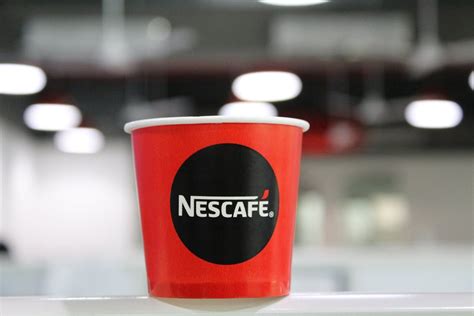 Red And Black Nescafe Coffee Cup · Free Stock Photo