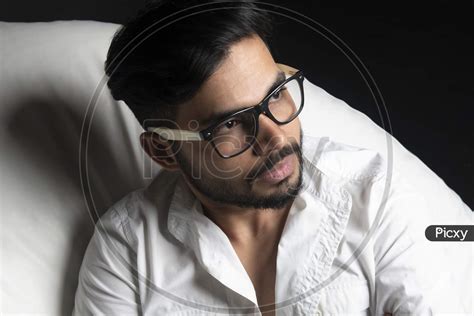 Image Of Portrait Of Attractive Indian Male Model Wearing Spectacles And Posing In An Shoot