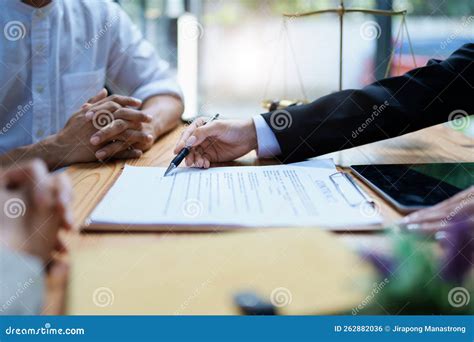 Lawyer Hands Important Documents To Couple To Sign Stock Photo Image