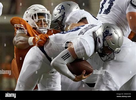 Rice Quarterback Jake Constantine 10 Is Sacked By Texas Defensive