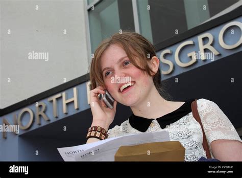 Students at a UK comprehensive school receive their exam results ...