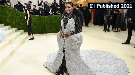 Simone Biles Dons A Showgirl Inspired Dress At The Met Gala The New