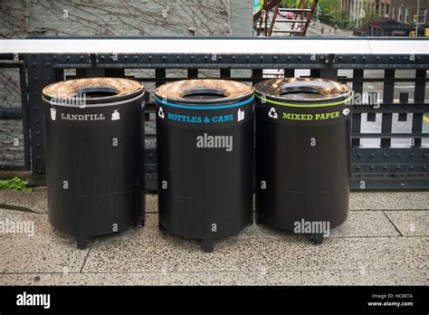 Three Trash Bins For Different Types Of Garbage In The Streets Of New