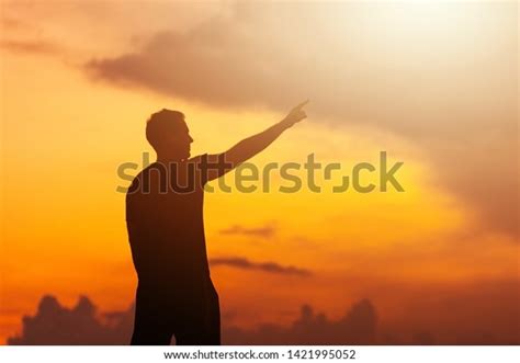 Silhouette Man Hands Raised Sunset Empowered Stock Photo