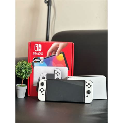 เครื่องเกมส์ Nintendo Switch สีขาว Oled มือ2 สภาพดีครับมีตำหนิใช้งานได้ปกติครับ Shopee Thailand