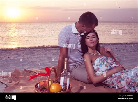 Passion Couple On The Beach Sunset Man Kissing Young Woman On The