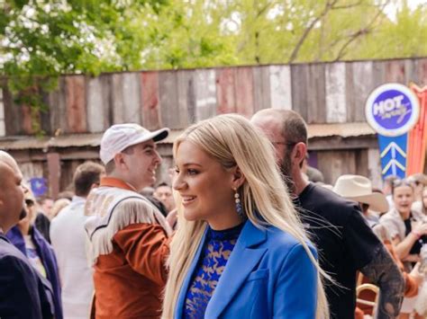 Kelsea Ballerini Embraces Sheer Trend In Starry Top And Blue Power Suit At Cmt Hot 20 Countdown Live