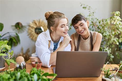 Artistic Lesbian Couple Engrossed In Laptop Stock Image Image Of Lgbtq Technology