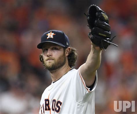 Photo: Astros pitcher Cole salutes fans in the eighth inning during ...