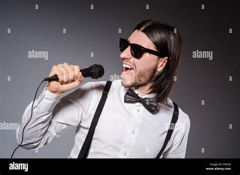 Funny Singer With Microphone At The Concert Stock Photo Alamy