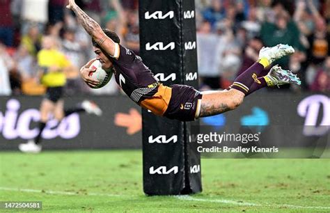 Reece Walsh of the Broncos scores a try during the round 2 NRL match ...