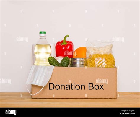 Donation Box With Various Food Open Cardboard Box With Oil Canned