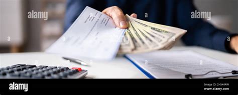 Handing Money Hi Res Stock Photography And Images Alamy