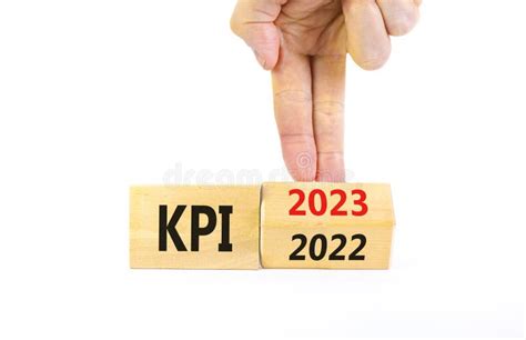 Kpi Key Performance Indicator Symbol Businessman Turns Wooden Cubes