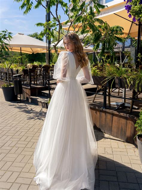 V-neck ball gown wedding dress with long balloon sleeves