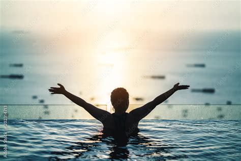 Black Silhouette Of Asian Woman Splash Water On Summer Vacation Holiday