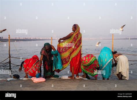 Pilgrims Prepare To Bathe In The Holy Waters Of The Ganges River During