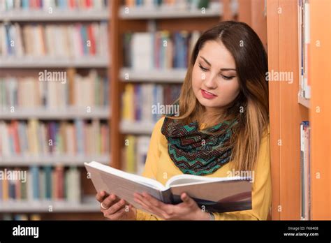 Portrait Of An Caucasian College Student Woman In Library Shallow