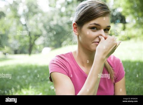 Woman Holding Nose Stock Photo Alamy