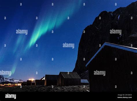 Northern Lights Aurora Borealis In The Starry Night Sky Over