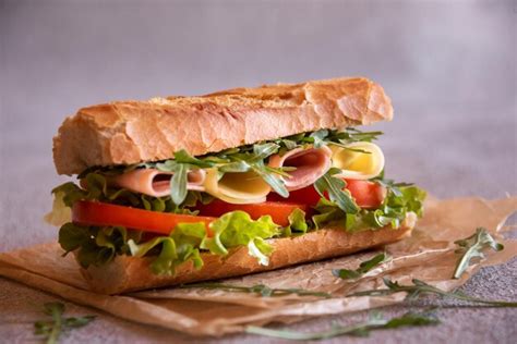 Premium Photo Baguette Sandwich With Cheese Ham Tomatoes And Vegetables