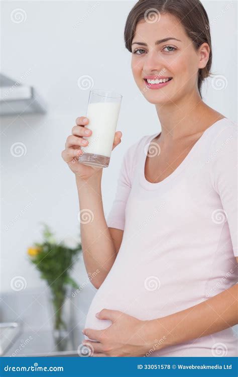 Pregnant Woman Drinking A Glass Of Milk Royalty Free Stock Photos