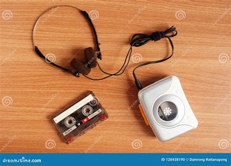 Old Portable Cassette Tape Player and Headphones on Wooden Stock Photo ...