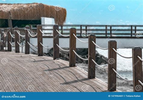 Pedestrian Bridge Along The Coast With A Fence With A Rope Sea Summer