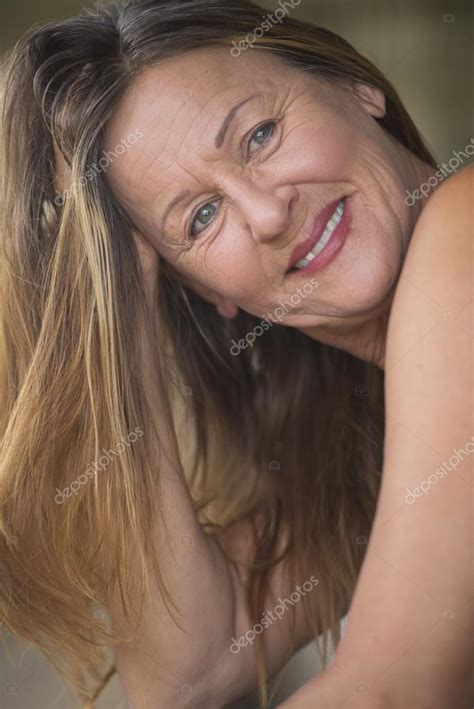Confident Attractive Mature Woman Posing Stock Photo By Roboriginal