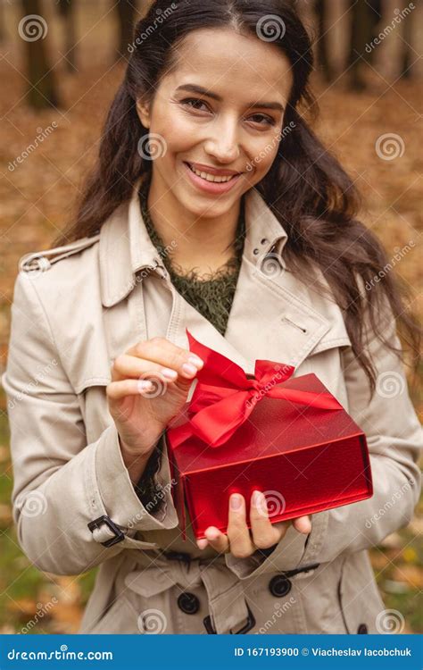 Portrait Of Pleased Brunette Girl That Posing On Camera Stock Photo