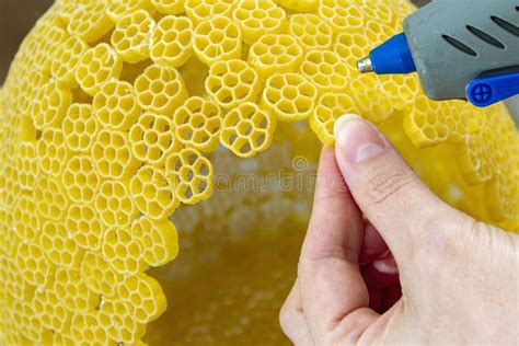 Woman Glues Pasta With A Hot Glue Gun During The Manufacture Of Crafts Stock Image Image Of