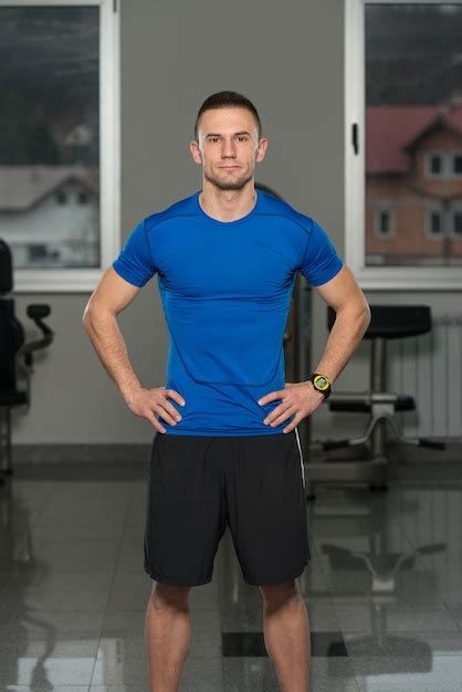 Premium Photo Handsome Personal Trainer Wearing Sportswear In Fitness