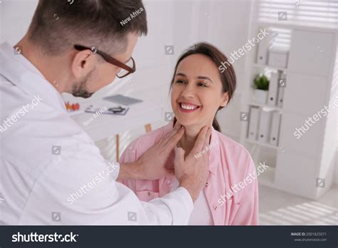 Doctor Examining Thyroid Gland Patient Hospital Stock Photo