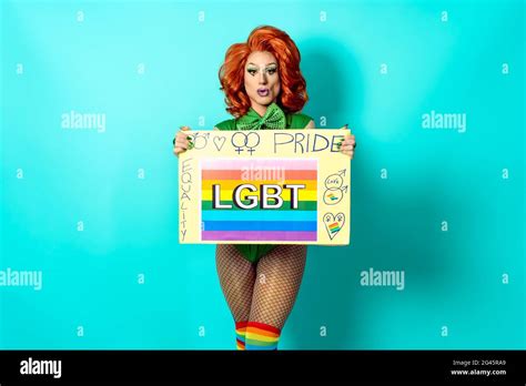 Happy Drag Queen Celebrating Gay Pride Holding Banner With Rainbow Flag