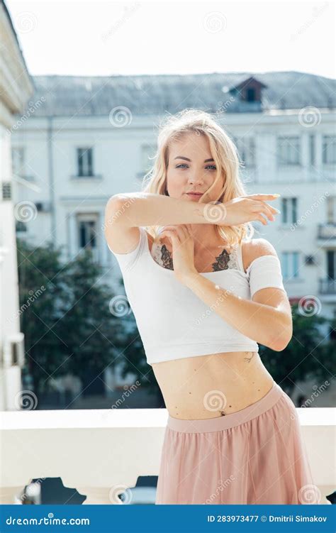 A Blonde Woman Standing On The Balcony In The Room Stock Image Image Of Terrace Summer 283973477