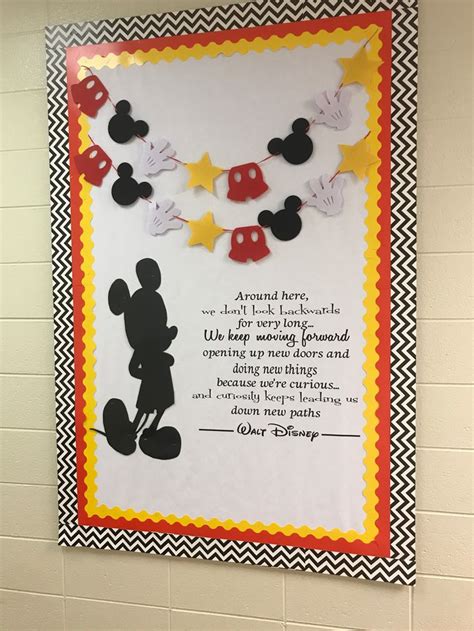 A Mickey Mouse Bulletin Board Hanging On The Wall