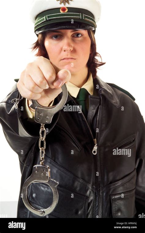 Young Female Police Officer Holding Handcuffs Stock Photo Alamy