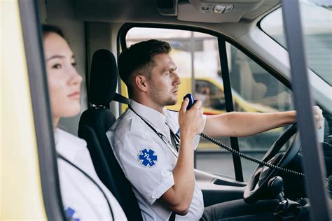 A Paramedic Using a Radio Inside an Ambulance · Free Stock Photo