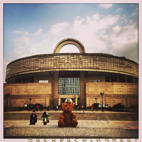 Joe Louis checks the Tibetan mask exhibit: Backpacking Bear