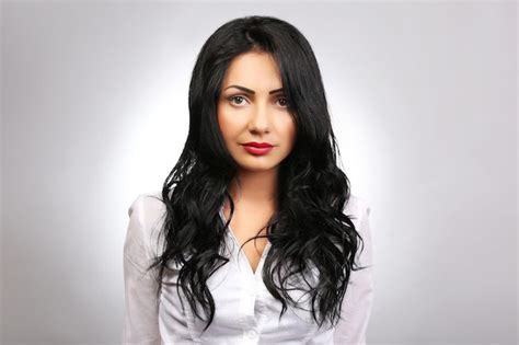 Premium Photo Portrait Of Pretty Brunette On Grey Background