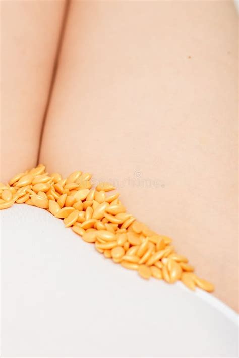 Sugaring Concept Wax Granules Lying In A Row On Female Bikini Area