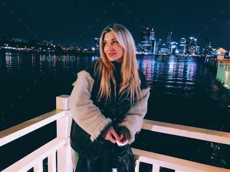 Beautiful Blonde Girl With Long Hair Enjoying Night Life Stock Photo By ElinaVeresk