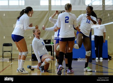 The Air Force Women S Volleyball Team Celebrates After They Score A